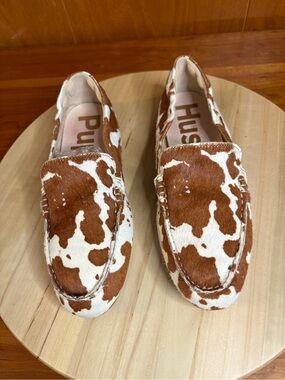limited edition Hush Puppies Cora loafers featuring a brown and white cow print